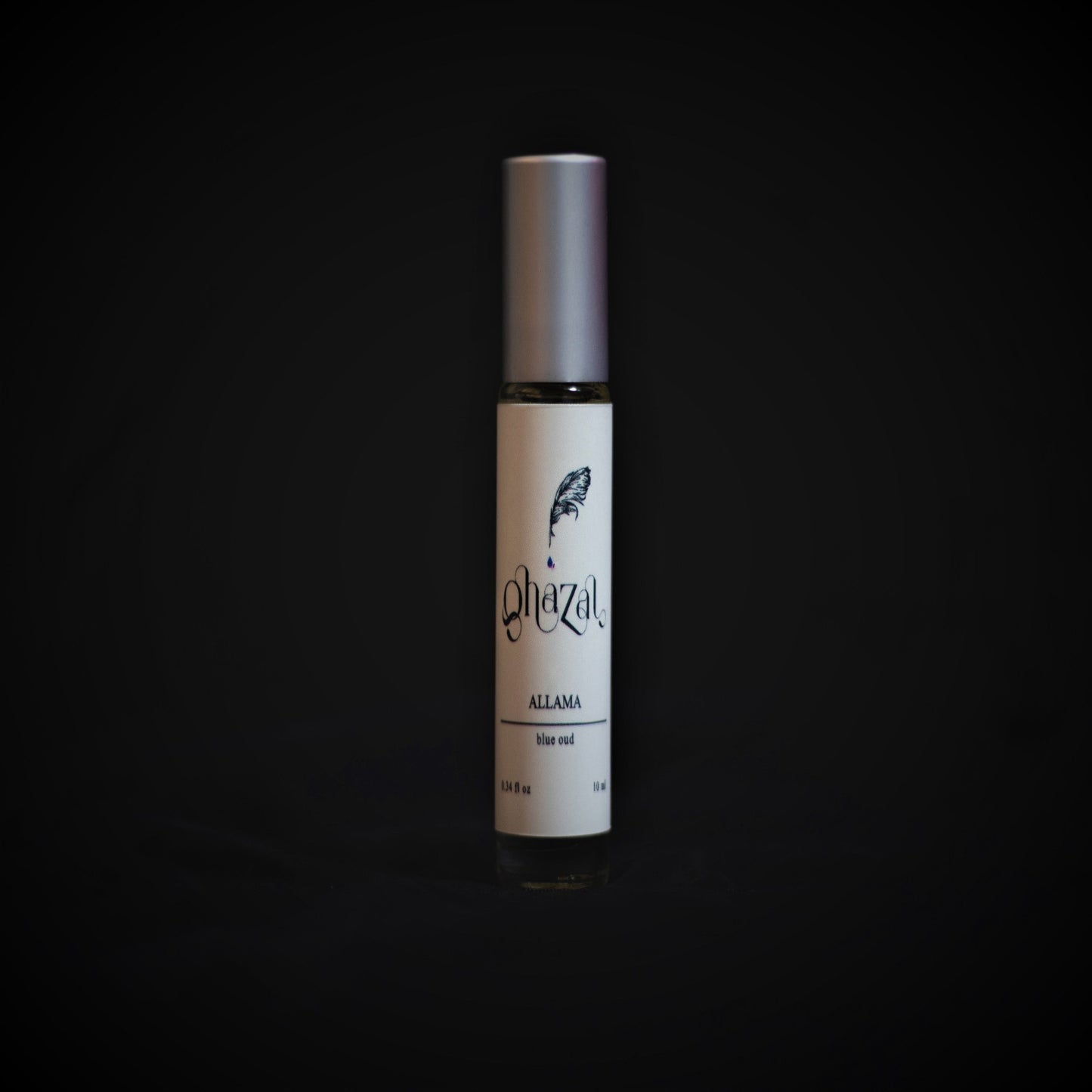 Photo of our perfume bottle Allama in a black background